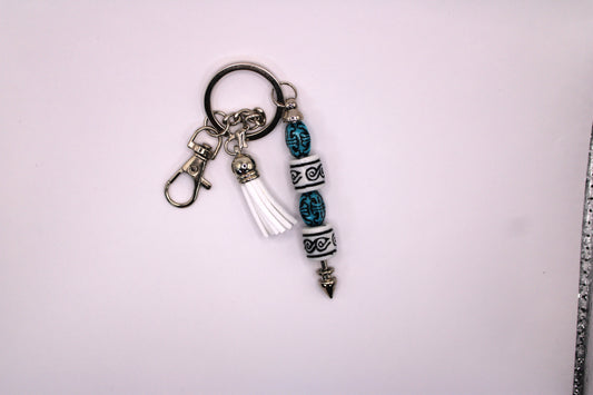 Silver Keychain With White Tassel